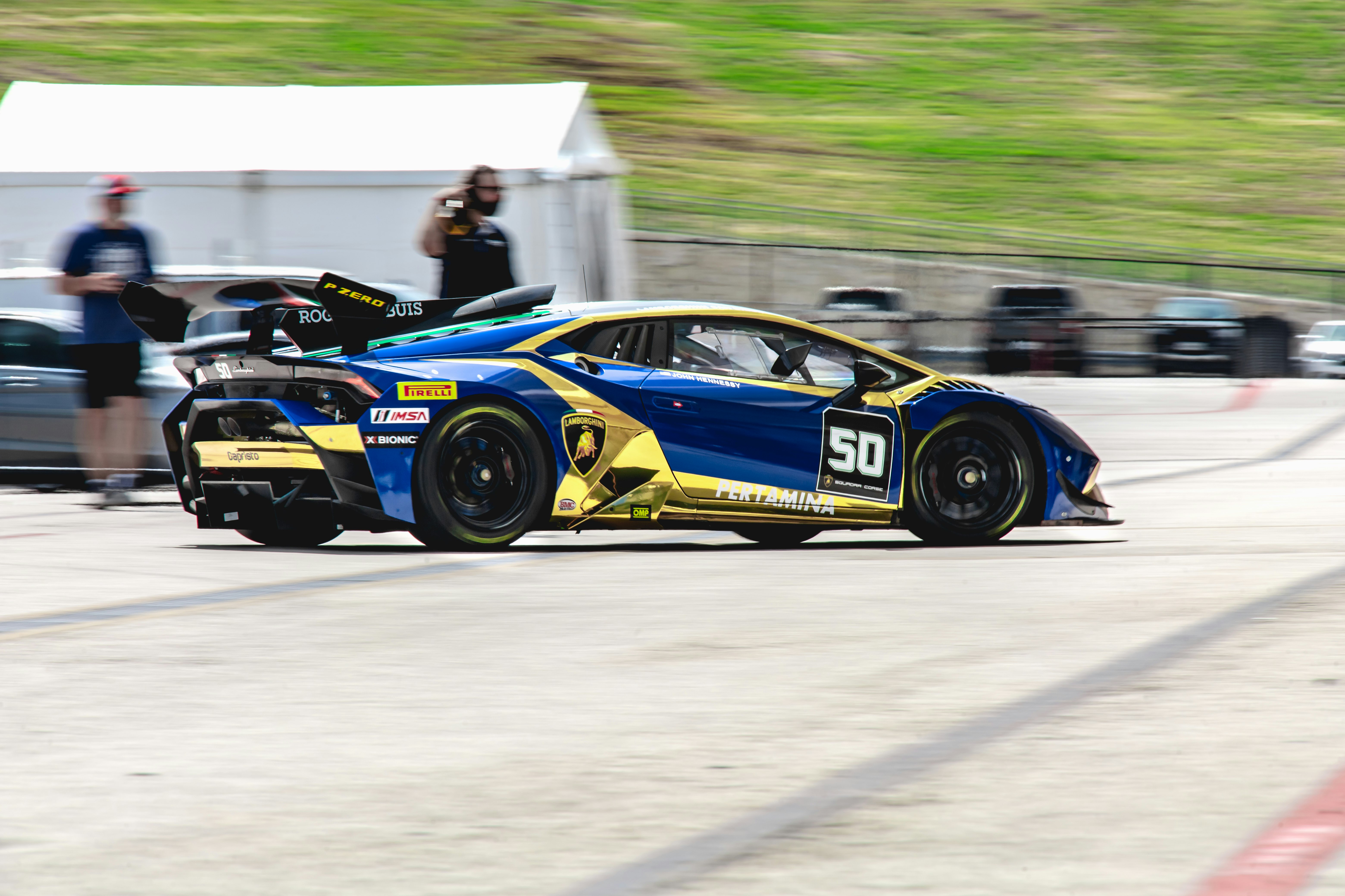 blue and black porsche 911 on race track